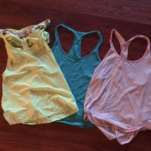 Three Razorback lulu workout shirts